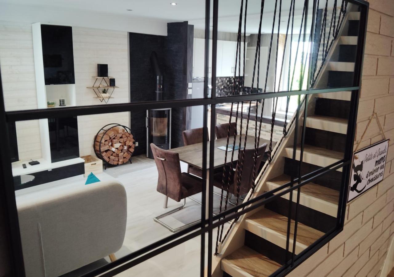 This holiday home provides a fireplace. Featuring a private entrance, this holiday home consists of 1 living room, 3 separate bedrooms and 1 bathroom with a shower and a hairdryer. The well-equipped kitchen has a stovetop, a refrigerator, a dishwasher and kitchenware. The holiday home features parquet floors, a seating area with a flat-screen TV with cable channels, a washing machine, soundproof walls, as well as a tea and coffee maker. The unit offers 3 beds.