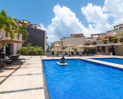 Aldea Thai Beachfront Condo Complex with Resort Pool & Amenities