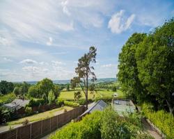 Cosy Snug with shower ensuite - It has beautiful countryside views - Only 3 miles from Lyme Regis, Charmouth and River Cottage - It has a private balcony and a real open fireplace - Comes with free private parking