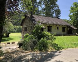 Ardennes villa with riverside garden and views