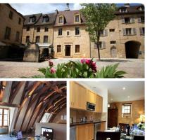 Le Grenier du Chapitre son loft avec les poutres et l'appartement une chambre sans les poutres