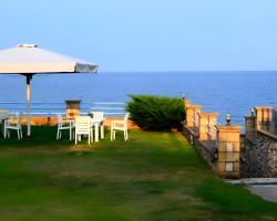 Alexandros Beachfront Apartments near Petalidi with Private Sunbeds & Sea View