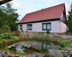 Apartment in the Harz with a log cabin pond and covered seating area