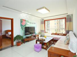 青岛金沙滩全家幸福三居室海景公寓Blessed Family Apartment, hotel en Qingdao