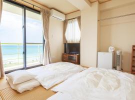 Kariyushi Condominium Ocean Hills Chouraku Stay ที่พักให้เช่าติดทะเลในKin