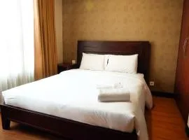 2BR Prestige Essence Dharmawangsa Apartment By Travelio