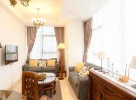 Comfy 2BR L'Avenue Apartment By Travelio