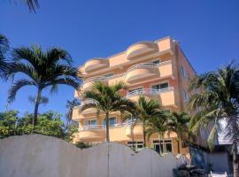 Aparta Hotel Caribe Paraiso, מלון בחואן דוליו