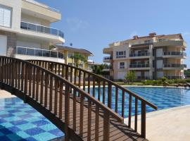 Antalya belek odyssey park ground floor 2 bedrooms pool view close to center, hotel in Belek