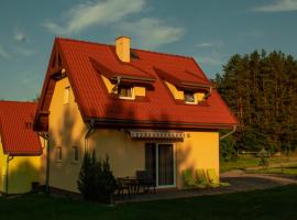 Mazurski domek, brunarica v mestu Mrągowo