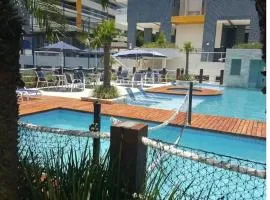 Apto pé-na-areia em Bertioga - Indaia Home Club