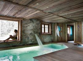 Chalet Javen - 520m2 avec piscine chauffée et home cinéma, hôtel à Megève