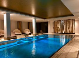 Sunny Suite 14 - charmant und elegant mit Pool und Saunabereich, hotell i Börgerende-Rethwisch
