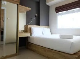 Modern and Bright 2BR Green Pramuka Apartment By Travelio