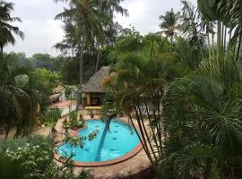 Breeze ocean palms villa ค็อทเทจในลามู