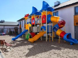 Domki Bałtycka 14a, ξενοδοχείο σε Grzybowo