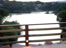LAS CABAÑAS DEL LAGO más pase piscina las 2 columnas Del 1 junio 2026 al 30 agosto 2026