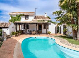 Encantadora casa con piscina privada y chimenea, cabaña o casa de campo en El Padul