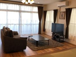 Amami Weekly House Nico Nico Nazeko-ten, hotel de playa en Amami