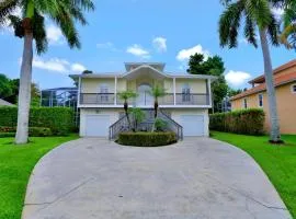 Florida-style home with pool and steps to beach