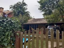 Casa Rústica praia da Ferrugem próximo praia com piscina compartilhada