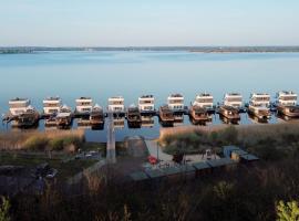 Hausboot Elandi, ubytování v soukromí na pláži v destinaci Bitterfeld