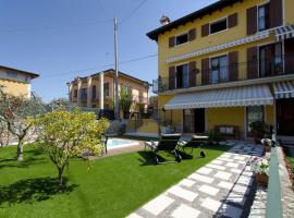 Accogliente apt al centro con giardino e jacuzzi, viešbutis mieste Torri del Benaco