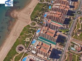 Apartamento 1&ordf; L&iacute;nea de mar en Marina d'Or con c&eacute;sped y playa [Familiar]