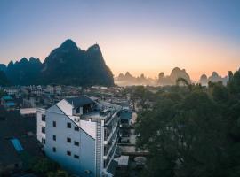 Ron Inn Xingping Hepan Xiaozhu, hotel económico em Yangshuo