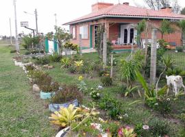 Casa de Praia para veraneio - temporada Balneário Gaivotas-SC Família Kunhasky, vikendica u gradu 'Balneário Gaivotas'