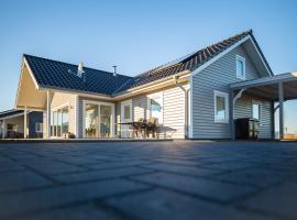 Dänisches Blockhaus direkt am Wangermeer, hôtel à Wangerland