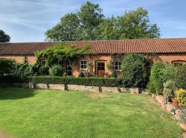 Stable Cottage, hotel con estacionamiento en Withernwick