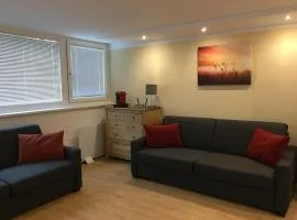 Cosy flat in the quiet area with own garden, free parking and direct public transport link to the centre