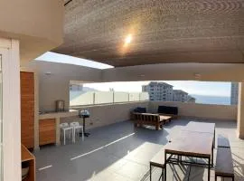 Departamento Familiar con Terraza Panorámica y a Pasos de la Playa en Punta Puyai