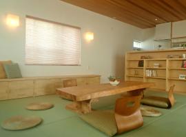 Guest House Ishigaki، فندق في جزيرة إيشيغاكي