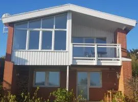 Modern villa i Arild med spektakulär havsutsikt.
