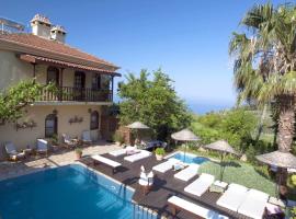 Viesnīca 6 bedrooms villa with sea view private pool and jacuzzi at Fethiye 2 km away from the beach pilsētā Faralya