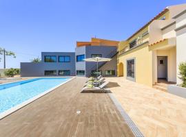 4 bedrooms house with sea view shared pool and enclosed garden at Quelfes, hotel sa Quelfes
