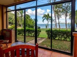 Warm Interiors and Orange Hues on Ground Floor in Front of Beach