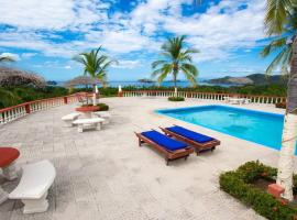 Coco Joya Condo - pool with 180 ocean view - all in walking distance, cabaña o casa de campo en Coco