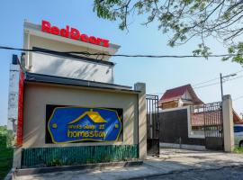 RedDoorz near Padang Golf Adisucipto, hotel met parkeren in Potrojayan