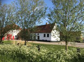 Maenhoudthoeve met zwembad en sauna, sumarhús í Oudenburg