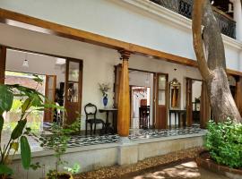 Kariappa House, &xi;&epsilon;&nu;&omicron;&delta;&omicron;&chi;&epsilon;ί&omicron; &mu;&epsilon; &pi;&iota;&sigma;ί&nu;&alpha; &sigma;&epsilon; &Pi;&omicron;&nu;&tau;&iota;&sigma;&epsilon;&rho;ί