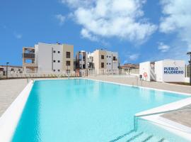 HomeForGuest Flat with large terrace in modern residential complex with swimming pool, accessible hotel in Caleta De Fuste