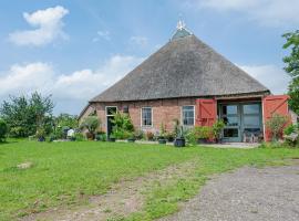 Characteristic head neckhull farm with rowing boat, cheap hotel in Burum