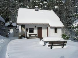 Cosy small holiday home at the edge of the forest with a magnificent view, cabin in Malá Skála