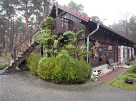 Holiday home in the forest, hotel with parking in Schmogrow