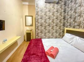 Tini's Guest House Malang Mitra RedDoorz, hotel with parking in Betek