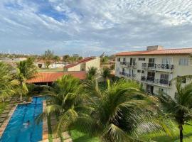 Apartamento com vista para o mar, piscina , deck , playground e estacionamento ., apartman u gradu 'Taíba'