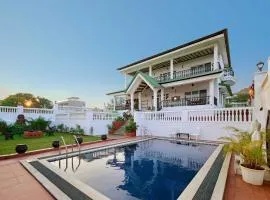 Ananda Villa by StayVista - A serene escape with Mountain-view, Heritage interiors, Swimming pool & Lush lawn